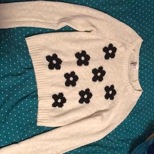 So cream sweater with black flowers.